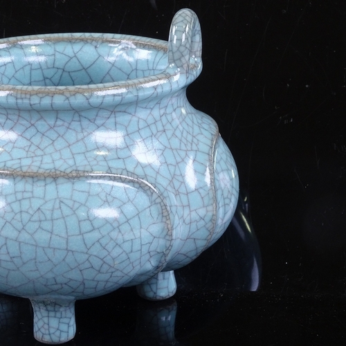 529 - A Chinese pale blue crackle glaze porcelain censer with ring handles, rim diameter 10cm, height to r... 