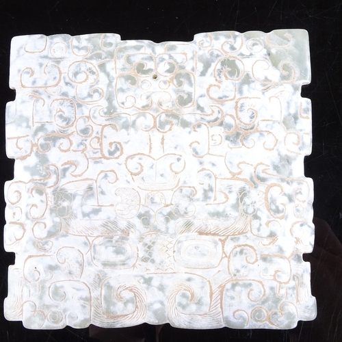 532 - An Archaic style nephrite jade plaque, with relief carved scroll design, 13cm x 13cm