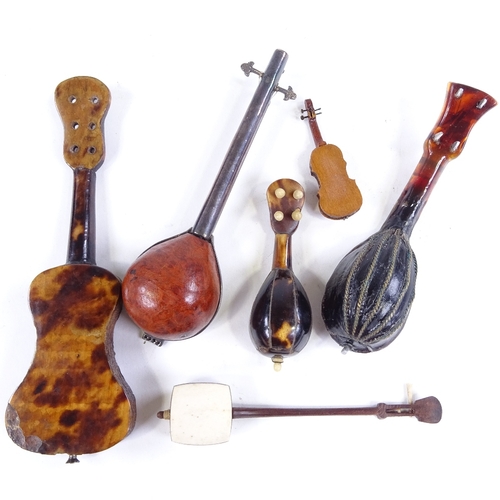 534 - A small group of miniature mother-of-pearl mandolins, guitars and other instruments (6)