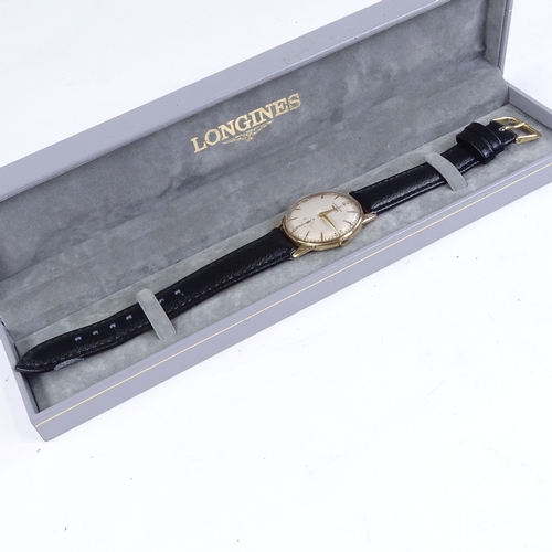 1014 - LONGINES - a Vintage 9ct gold mechanical wristwatch, silvered dial with gilt quarterly Arabic numera... 