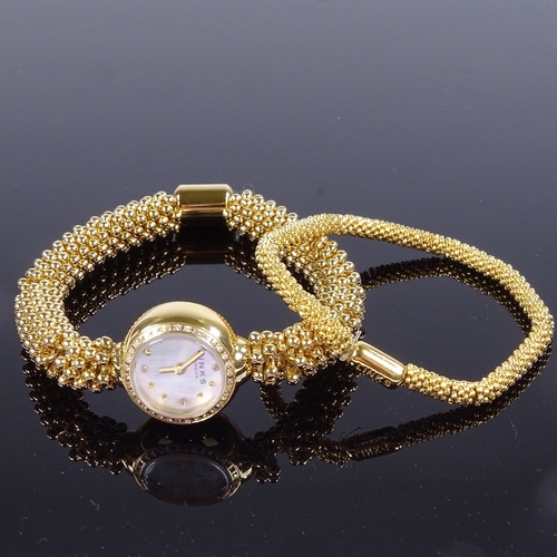 1036 - LINKS OF LONDON - a lady's gold plated stainless steel and silver Effervescence matching quartz wris... 