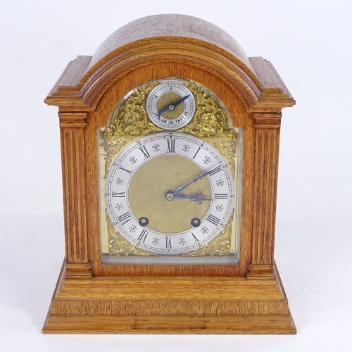 1062 - A late 19th/early 20th century German light oak-cased dome-top mantel clock, by Lenzkirch, architect... 