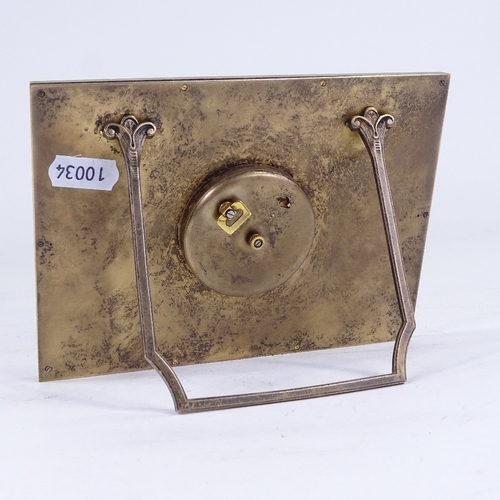 1064 - An Art Deco Swiss 8-day desk clock, brass frame with brushed brass dial and applied gilt Arabic nume... 