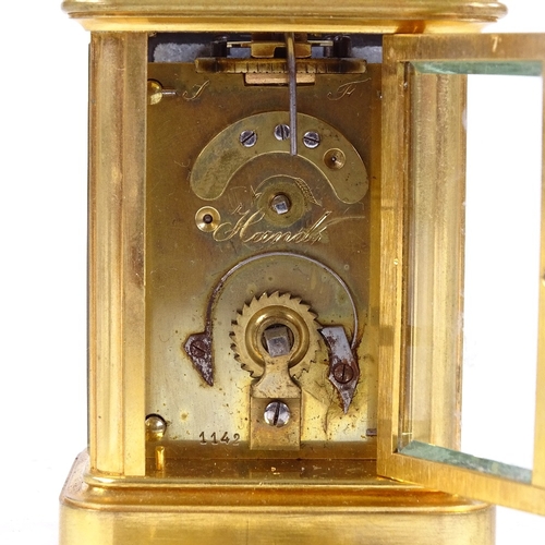 1065 - A 19th century miniature brass-cased carriage clock timepiece, white enamel dial with Roman numeral ... 