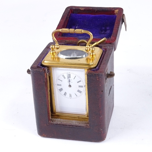 1065 - A 19th century miniature brass-cased carriage clock timepiece, white enamel dial with Roman numeral ... 