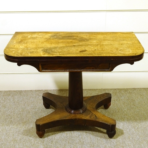 346 - A 19th century rosewood fold over card table, on platform base