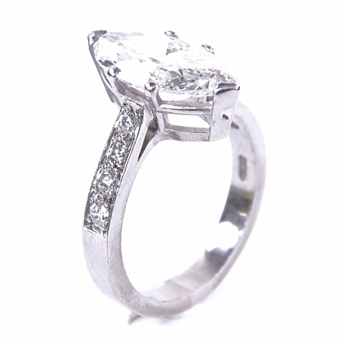 1102 - A 3.75ct marquise brilliant-cut solitaire diamond ring, graduated round brilliant-cut diamond should... 