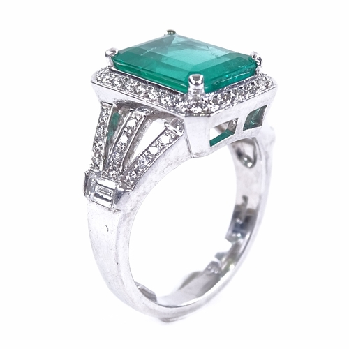 1107 - A rectangular emerald and diamond cluster ring, central large emerald step-cut emerald approx 3.88ct... 