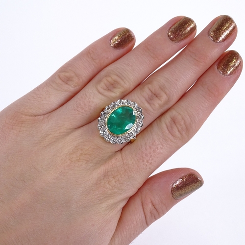 1108 - A large oval emerald and diamond cluster ring, central oval mixed-cut emerald approx 6.75ct, surroun... 