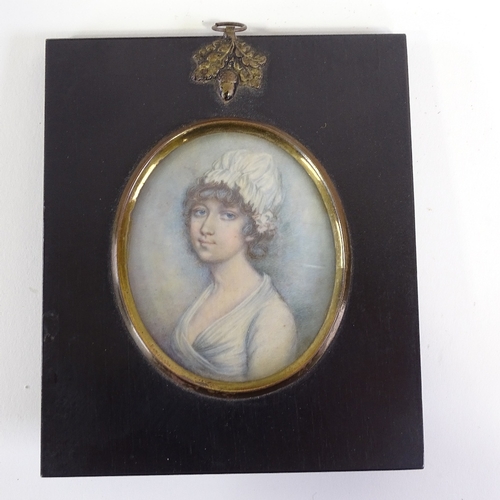 2197 - A 19th century miniature watercolour on ivory, portrait of a woman in ebonised frame, overall frame ... 