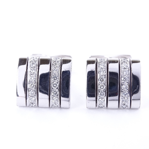 1117 - A pair of 18ct white gold diamond cufflinks, each rectangular panel set with a double-row of round b... 