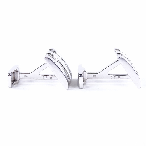 1117 - A pair of 18ct white gold diamond cufflinks, each rectangular panel set with a double-row of round b... 