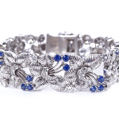 1118 - A sapphire and diamond floral bracelet, floral spray panels set with round-cut sapphires and diamond... 