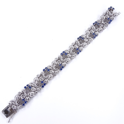 1118 - A sapphire and diamond floral bracelet, floral spray panels set with round-cut sapphires and diamond... 