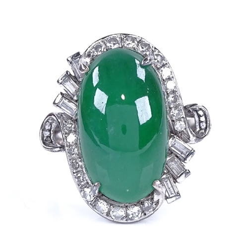 1120 - A cabochon jadeite and diamond cluster ring, set with large central cabochon jadeite, surrounded by ... 