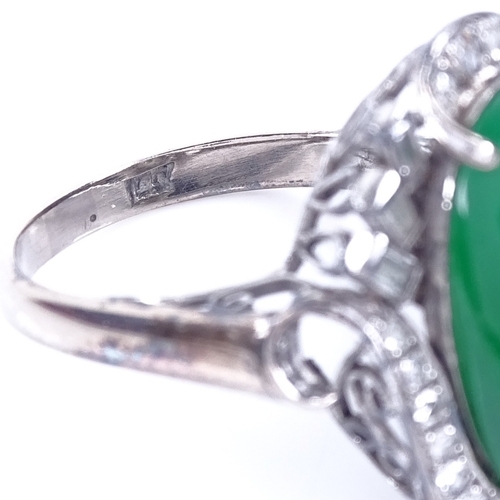 1120 - A cabochon jadeite and diamond cluster ring, set with large central cabochon jadeite, surrounded by ... 