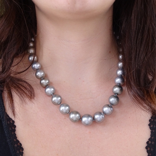 1127 - A single-row grey cultured South Sea pearl and diamond necklace, comprising a graduated row of 33 gr... 