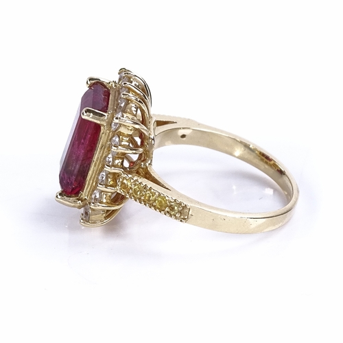 1131 - A pink tourmaline diamond and yellow sapphire cluster ring, set with 5.5ct emerald-cut pink tourmali... 