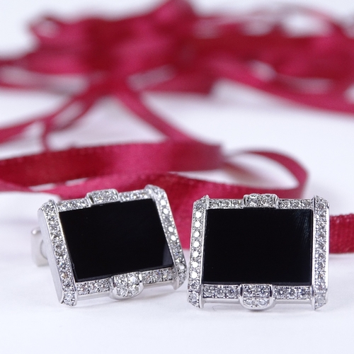 1132 - A pair of Art Deco style 18ct white gold onyx and diamond cluster cufflinks, geometric form, set wit... 