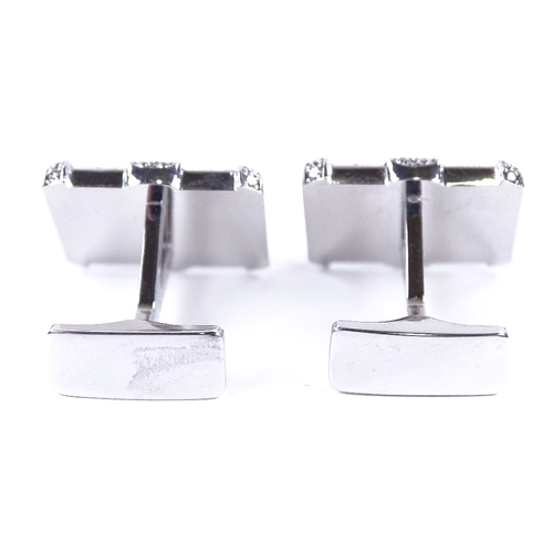 1132 - A pair of Art Deco style 18ct white gold onyx and diamond cluster cufflinks, geometric form, set wit... 