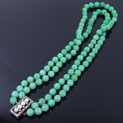 1133 - A double-row polished jade pearl and diamond necklace, 101 individually knotted jade beads measuring... 