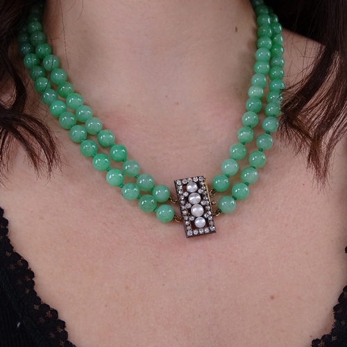 1133 - A double-row polished jade pearl and diamond necklace, 101 individually knotted jade beads measuring... 