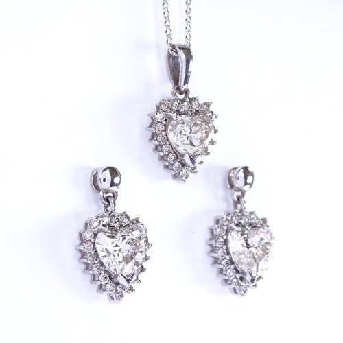 1135 - A heart shaped diamond cluster pendant necklace and stud earring demi-parure, set with central heart... 