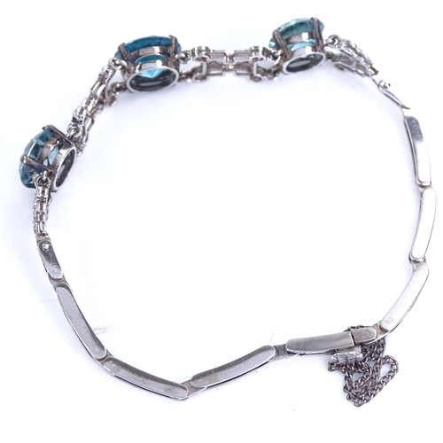 1136 - An 18ct white gold blue zircon and rose-cut diamond bracelet, Art Deco geometric form, set with grad... 