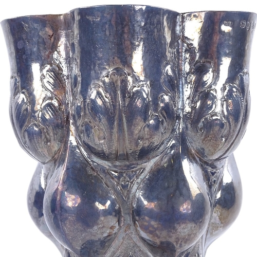 1138 - A large late 19th century German silver cup, Hanau, body and foot decorated with 6 lobes with inters... 