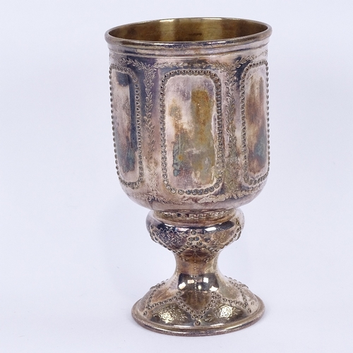 1140 - A Victorian silver footed goblet, cylindrical form with beaded panels and bright-cut engraved foliat... 