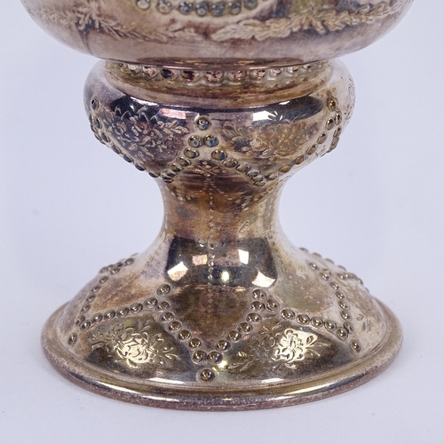 1140 - A Victorian silver footed goblet, cylindrical form with beaded panels and bright-cut engraved foliat... 