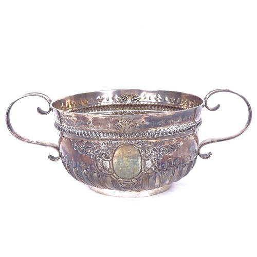 1142 - A Victorian silver 2-handled 3-pint punch bowl, formed as a 17th century porringer, half-fluted deco... 