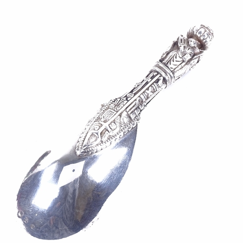 1148 - An early 20th century Danish silver presentation ladle, religious figure decorated handle with folia... 