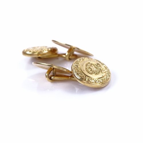 1153 - A pair of late 19th/early 20th century 18ct gold oval panel cufflinks, Order of the Garter decoratio... 