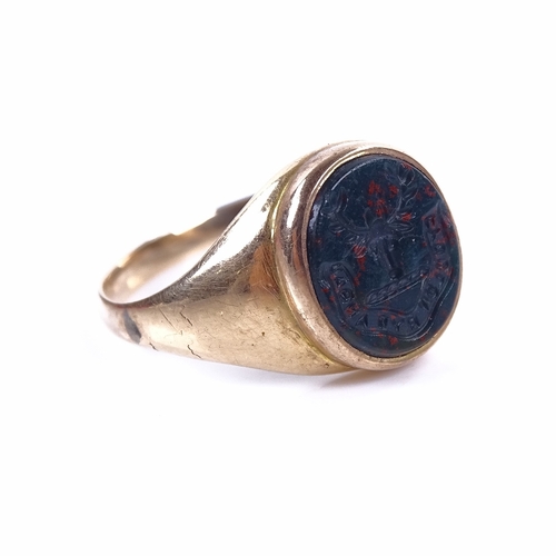 1155 - A 19th century unmarked gold bloodstone seal signet ring, intaglio carved stag-head emblem with mott... 