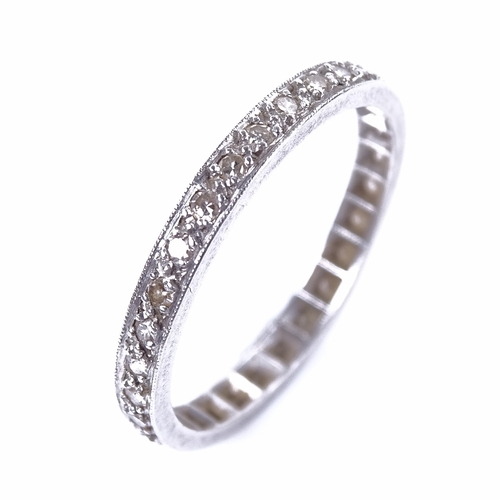 1156 - An early 20th century unmarked white metal diamond eternity ring, total diamond content approx 0.3ct... 