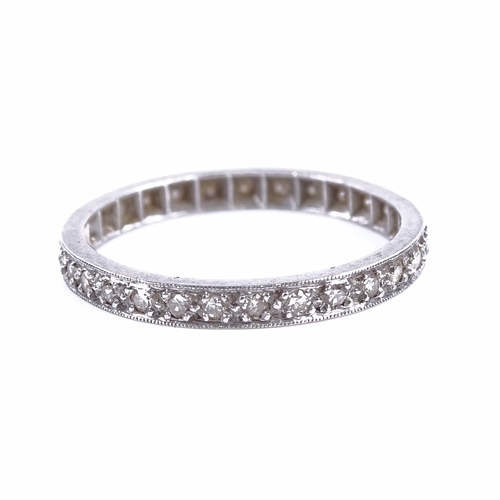 1156 - An early 20th century unmarked white metal diamond eternity ring, total diamond content approx 0.3ct... 