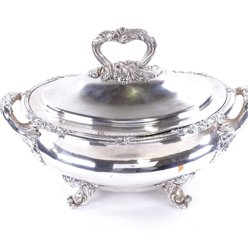 1619 - A large silver plated 2-handled soup tureen and cover, with cast foliate decoration on scrolled acan... 