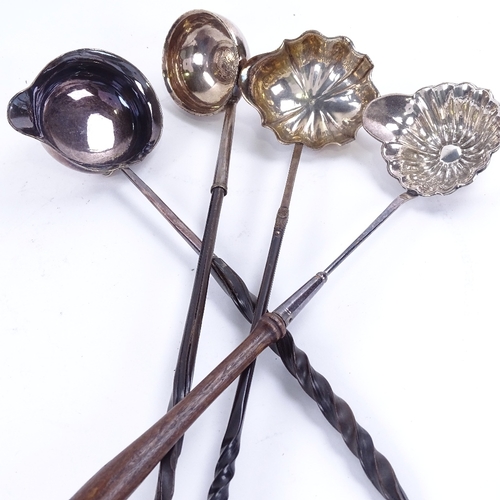 1624 - A large quantity of silver and silver plated toddy ladles and sifter spoon, including models with tw... 