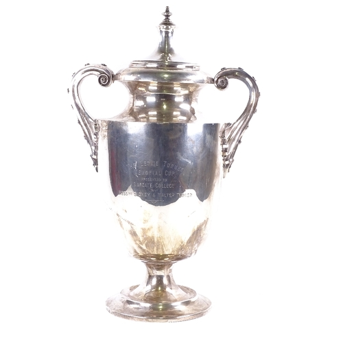 1634 - A large and impressive George V solid silver 2-handled trophy, with scrolled riveted style handles, ... 