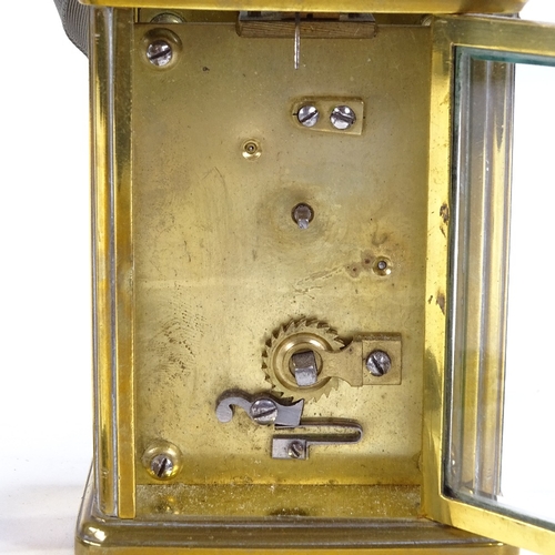 1067 - A brass-cased carriage clock timepiece, examined by Mappin & Webb, white enamel dial with Roman nume... 