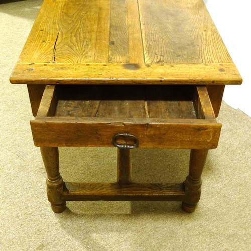 244 - An 18th/19th century oak farmhouse refectory table, with plank top and stretcher base, 145cm x 72cm