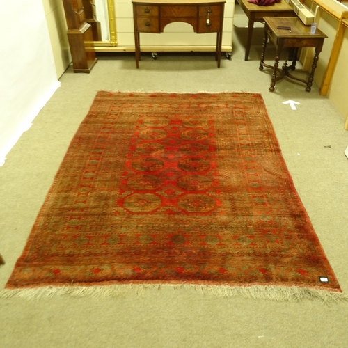 288 - A Persian handmade red ground geometric design rug, 290cm x 208cm.