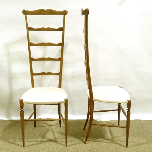 342 - A pair of mid-century Italian Chiavari exaggerated high back chairs, with shaped ladder backs