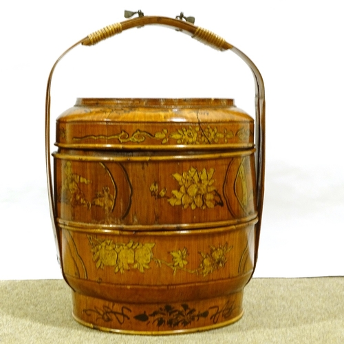 392 - A Chinese painted and gilded wood food carrier, with cane-bound bamboo carrying handle, diameter 38c... 