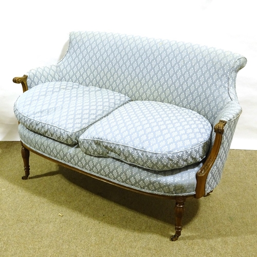 393 - A small Edwardian upholstered parlour sofa with carved show-wood arms, width 125cm