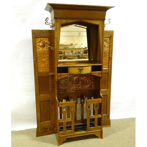 555 - An impressive Liberty & Co Art Nouveau oak hall stand, circa 1910, with impressed copper panels, cen... 