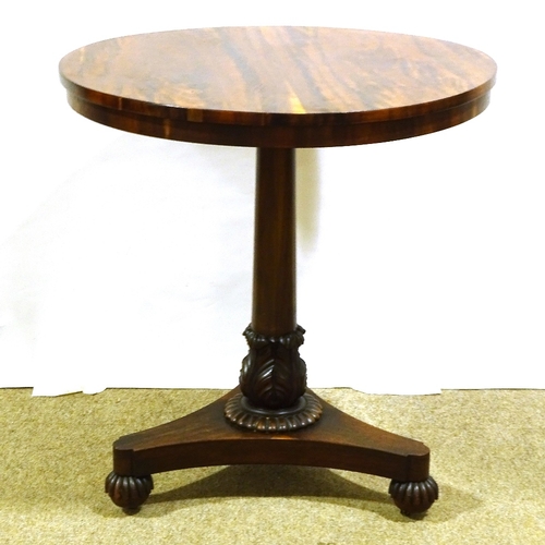 563 - A 19th century exotic wood circular centre table, on tulip carved column and shaped platform base, 6... 