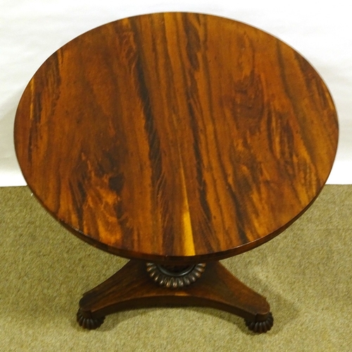 563 - A 19th century exotic wood circular centre table, on tulip carved column and shaped platform base, 6... 