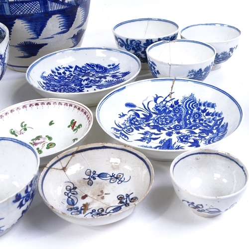 293 - A collection of 18th century English blue and white china, including sparrow-beak jugs, a pint mug, ... 